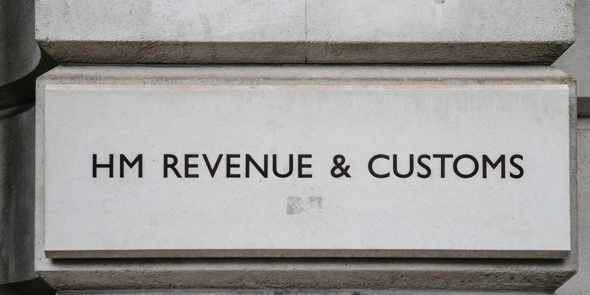 The HM Revenue & Customs sign on the wall next to the organisations entrance